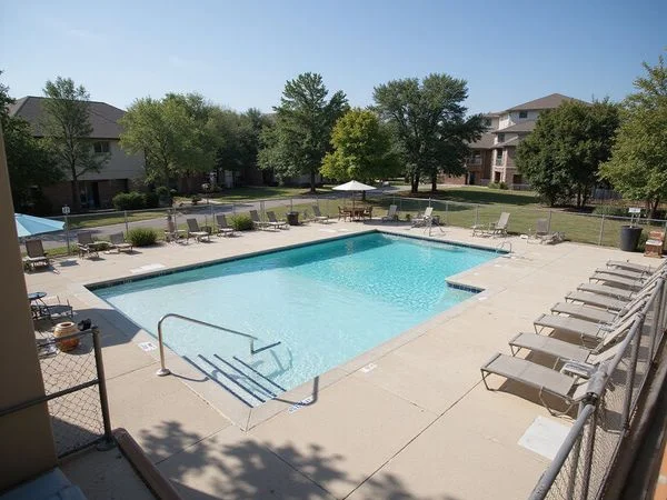 Unfinished pool deck behind fencing