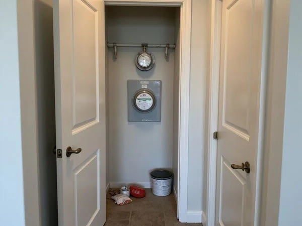 Utility closet in a new apartment hallway